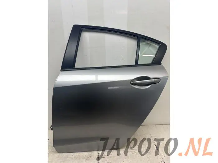Drzwi lewe tylne wersja 4-drzwiowa Mazda 3.